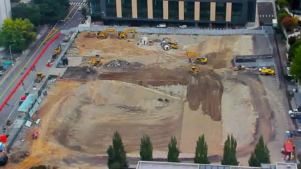 Construction camera frame at 8:15 AM PT. No visible change between these frames.