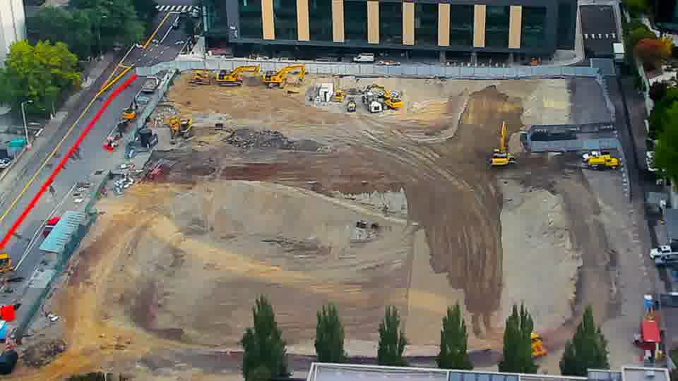 Construction camera frame at 9:15 AM PT. No visible change between these frames.