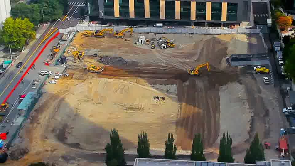 Construction camera frame at 10:15 AM PT. No visible change between these frames.