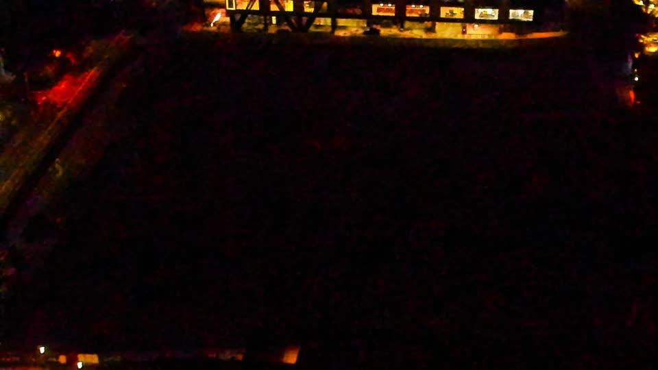 Construction camera frame at 5:00 AM PT. Visibility is too low to assess construction activity.