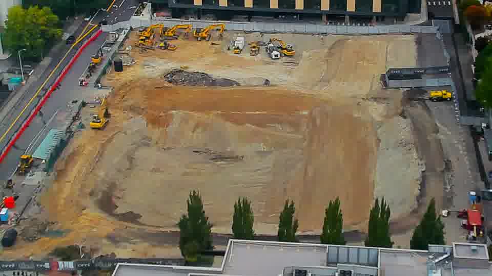 Construction camera frame at 12:00 PM PT. No visible change between these frames.