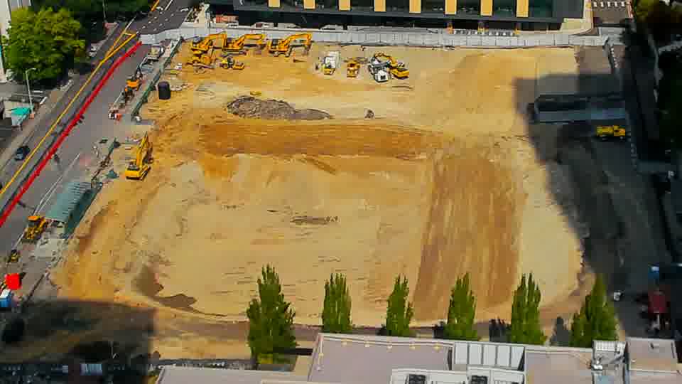 Construction camera frame at 12:30 PM PT. No visible change between these frames.