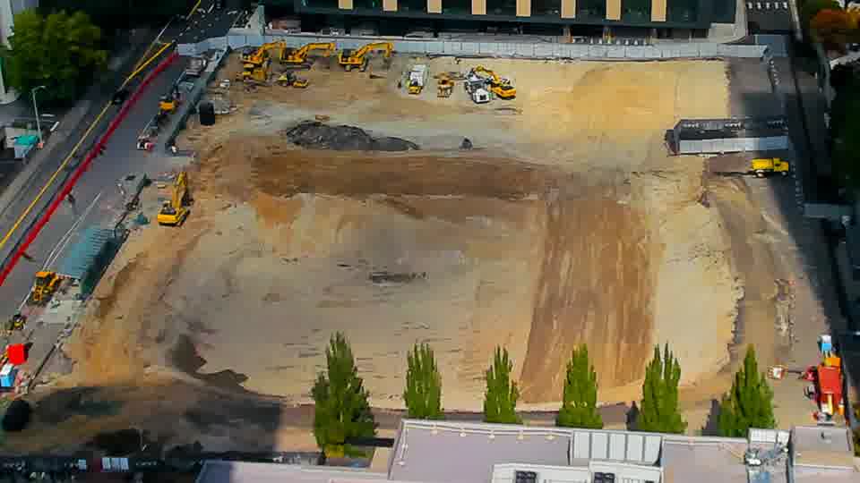 Construction camera frame at 12:45 PM PT. No visible change between these frames.