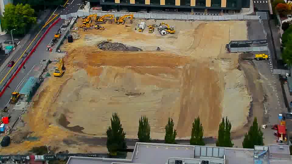Construction camera frame at 1:15 PM PT. No visible change between these frames.