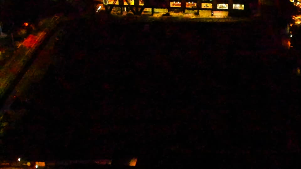 Construction camera frame at 3:00 AM PT. Visibility is too low to assess construction activity.
