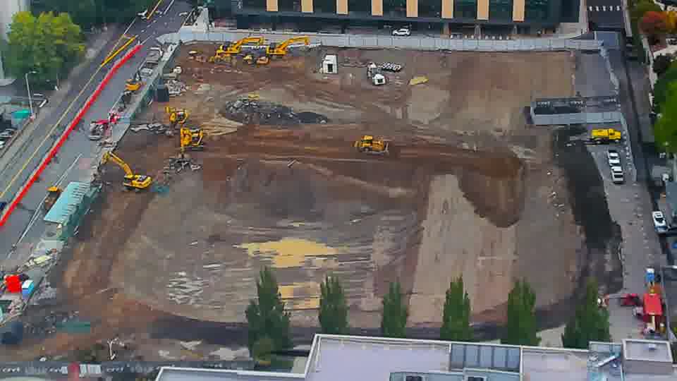Construction camera frame at 8:15 AM PT. No visible change between these frames.
