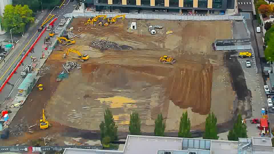 Construction camera frame at 10:15 AM PT. No visible change between these frames.