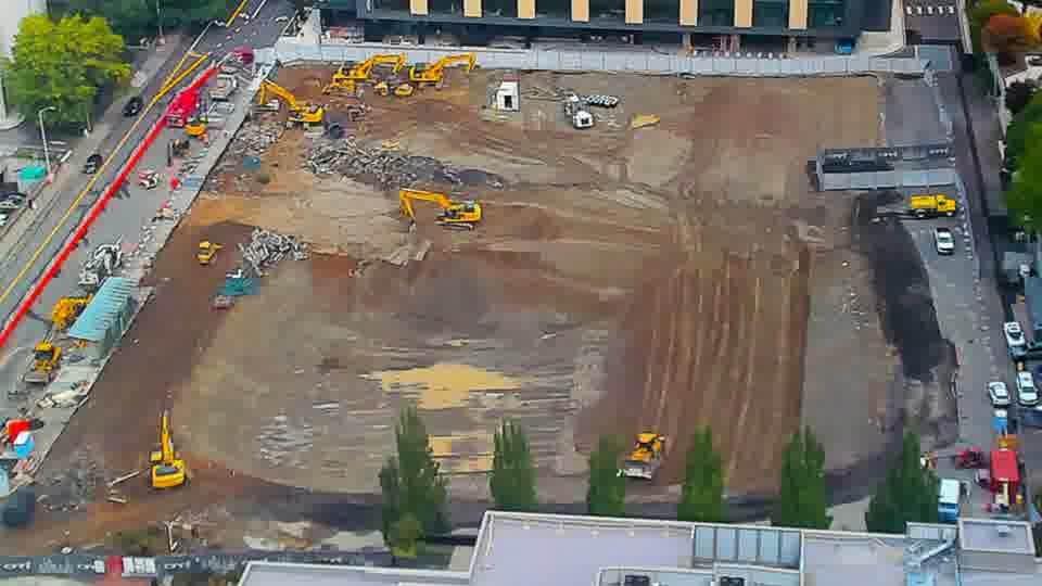 Construction camera frame at 11:00 AM PT. No visible change between these frames.