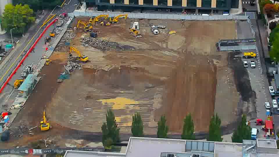 Construction camera frame at 11:15 AM PT. No visible change between these frames.