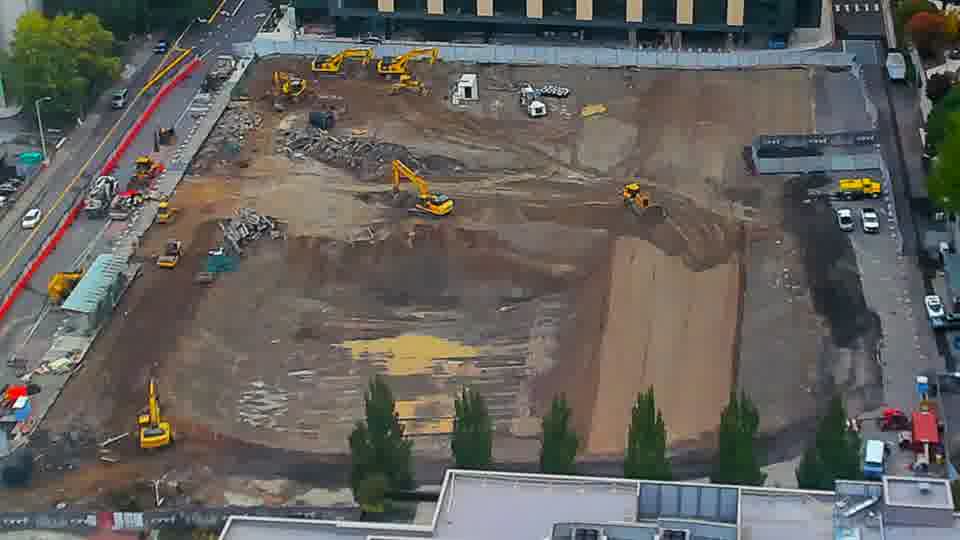 Construction camera frame at 12:00 PM PT. No visible change between these frames.