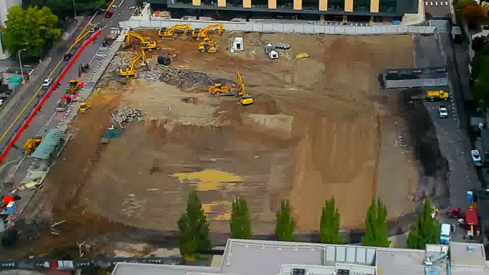 Construction camera frame at 12:30 PM PT. No visible change between these frames.