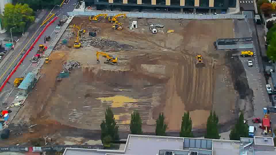 Construction camera frame at 12:45 PM PT. No visible change between these frames.