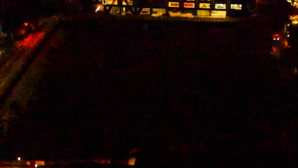Construction camera frame at 2:00 AM PT. Visibility is too low to assess construction activity.