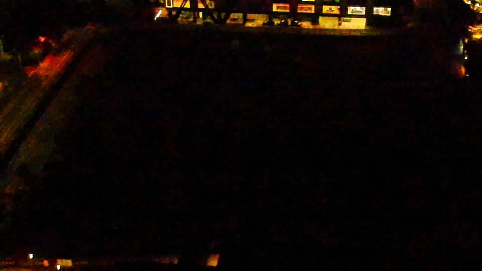 Construction camera frame at 4:00 AM PT. Visibility is too low to assess construction activity.