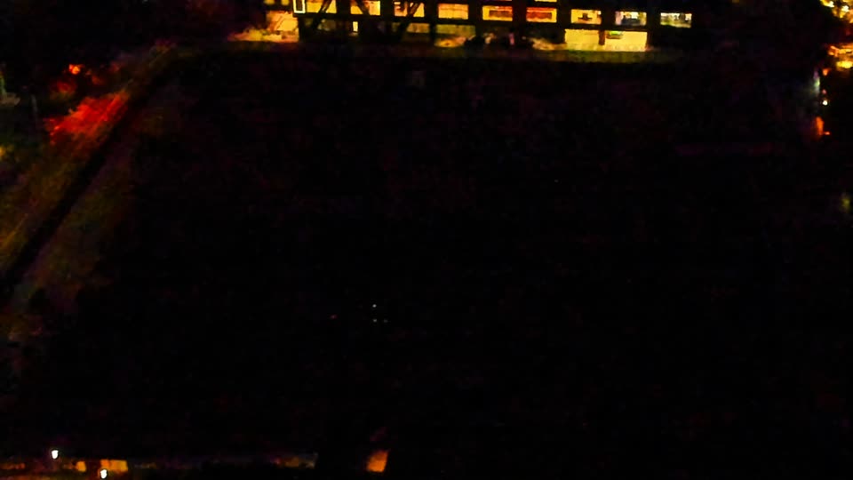 Construction camera frame at 5:00 AM PT. Visibility is too low to assess construction activity.