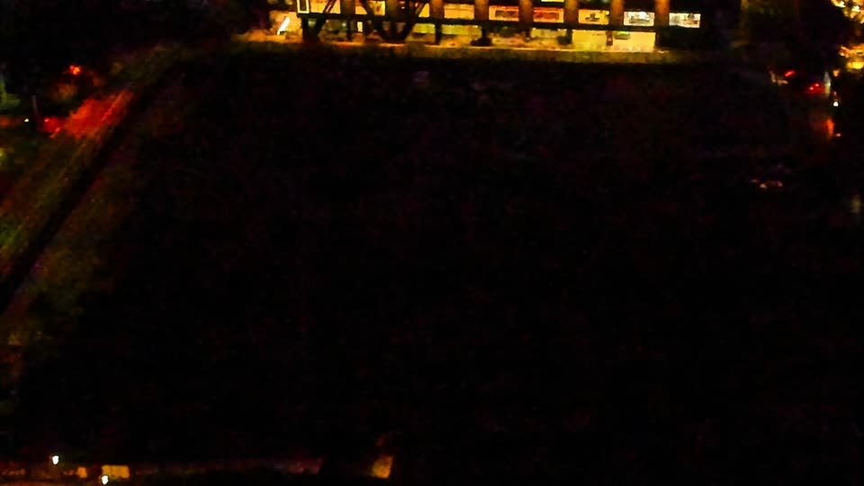 Construction camera frame at 6:00 AM PT. Visibility is too low to assess construction activity.