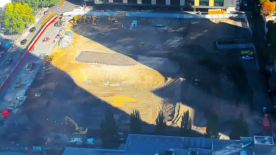 Construction camera frame at 10:15 AM PT. No visible change between these frames.