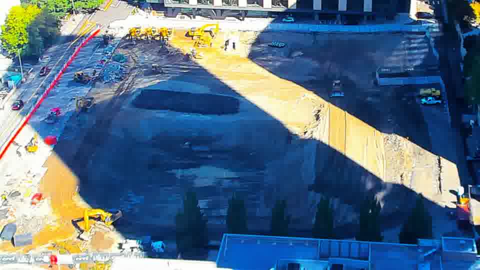 Construction camera frame at 11:00 AM PT. No visible change between these frames.