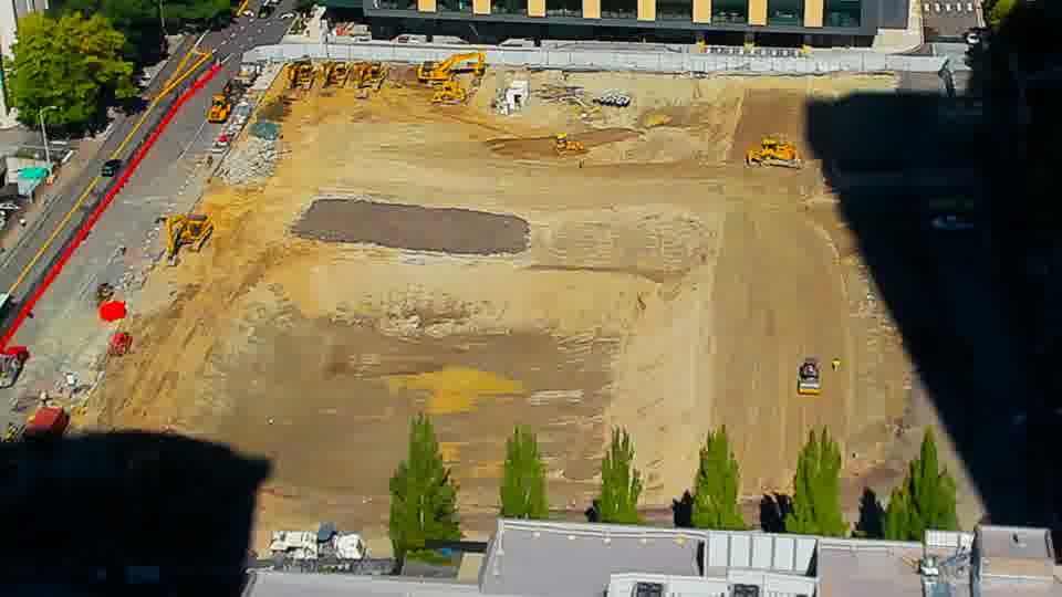 Construction camera frame at 12:30 PM PT. No visible change between these frames.