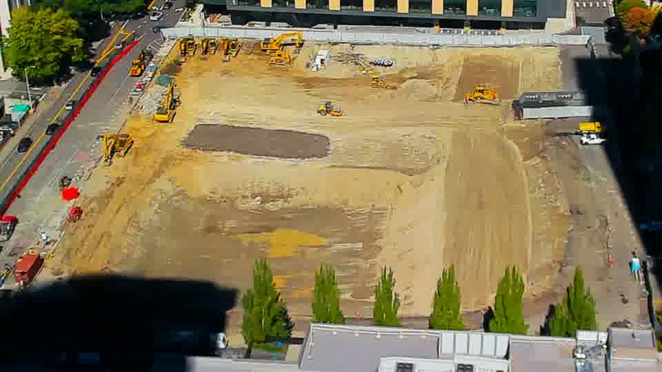 Construction camera frame at 12:45 PM PT. No visible change between these frames.
