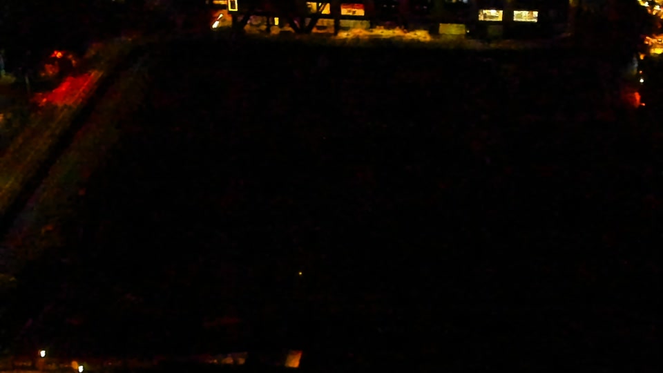 Construction camera frame at 2:00 AM PT. Visibility is too low to assess construction activity.