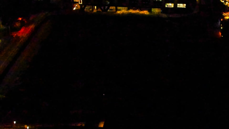 Construction camera frame at 3:00 AM PT. Visibility is too low to assess construction activity.
