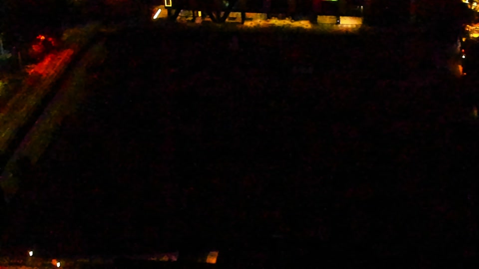 Construction camera frame at 1:00 AM PT. Visibility is too low to assess construction activity.