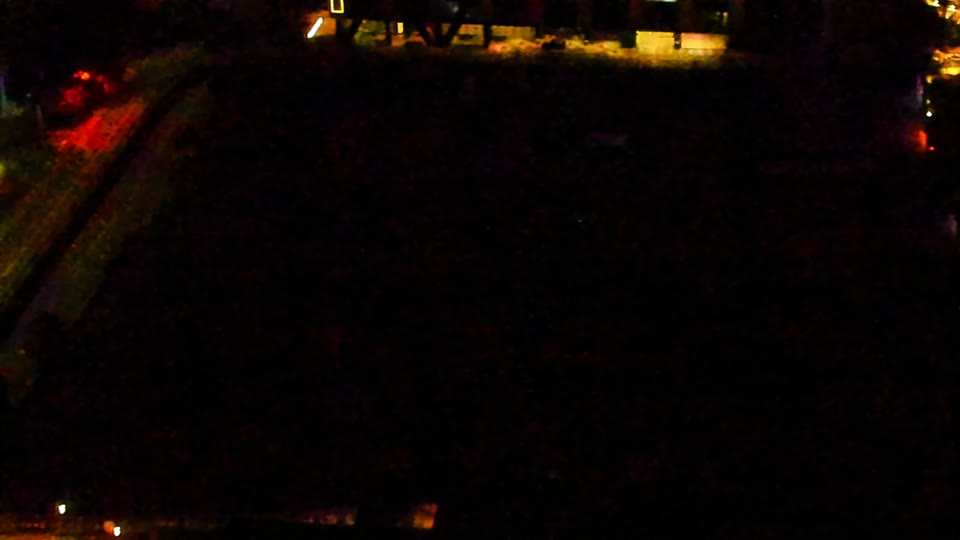 Construction camera frame at 2:00 AM PT. Visibility is too low to assess construction activity.