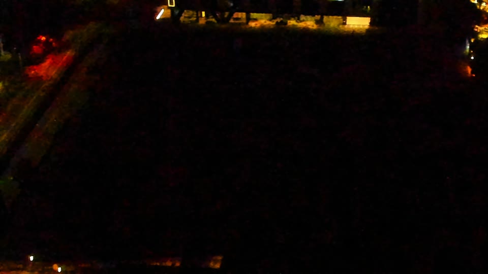 Construction camera frame at 3:00 AM PT. Visibility is too low to assess construction activity.
