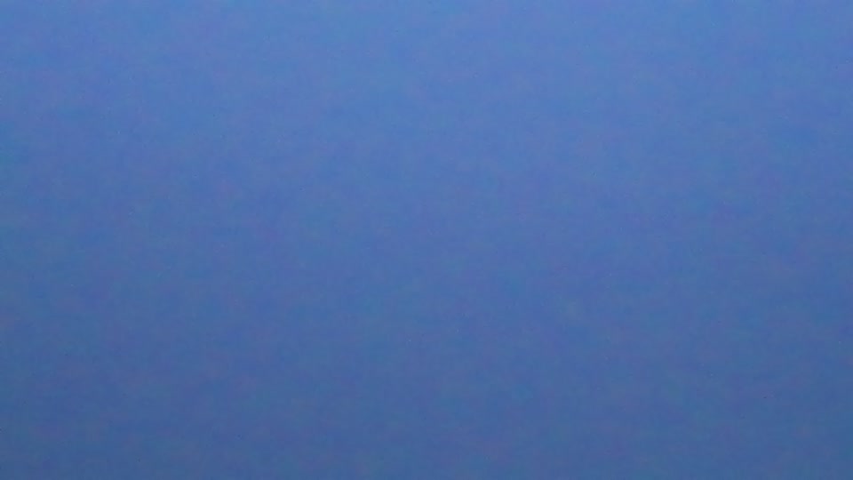 Construction camera frame at 7:15 AM PT. Visibility is too low to assess construction activity.
