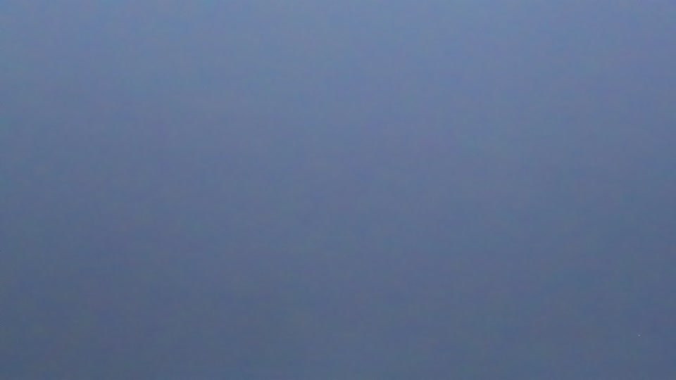 Construction camera frame at 7:45 AM PT. Visibility is too low to assess construction activity.