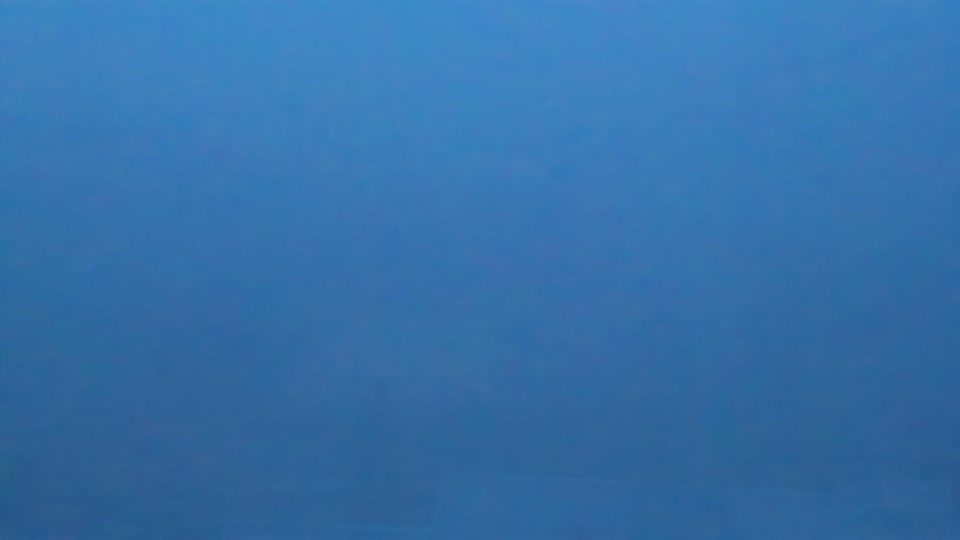 Construction camera frame at 8:15 AM PT. Visibility is too low to assess construction activity.