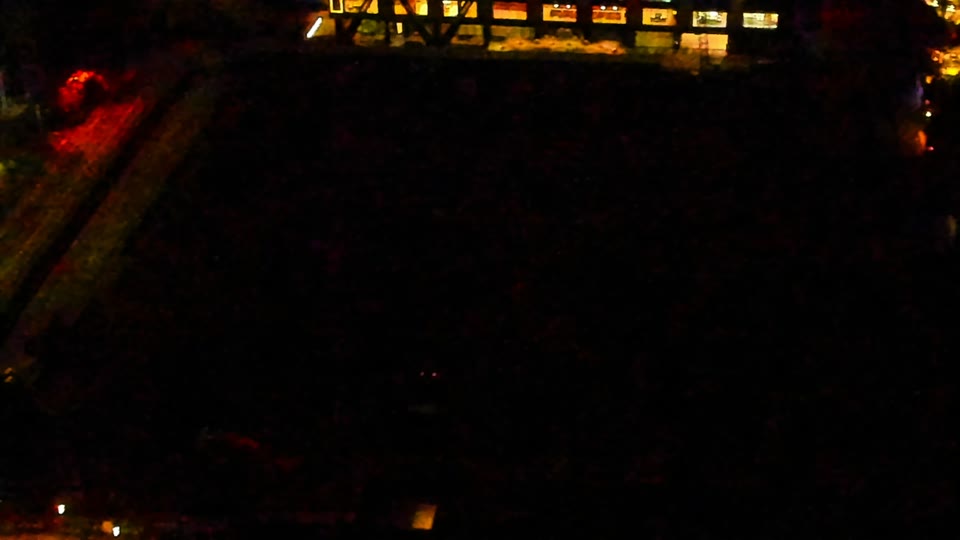 Construction camera frame at 1:00 AM PT. Visibility is too low to assess construction activity.